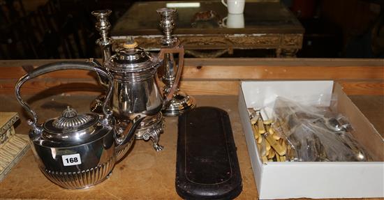 A pair of Sheffield plated candlesticks, a plated coffee bigin and sundry plated wares, including plated cutlery